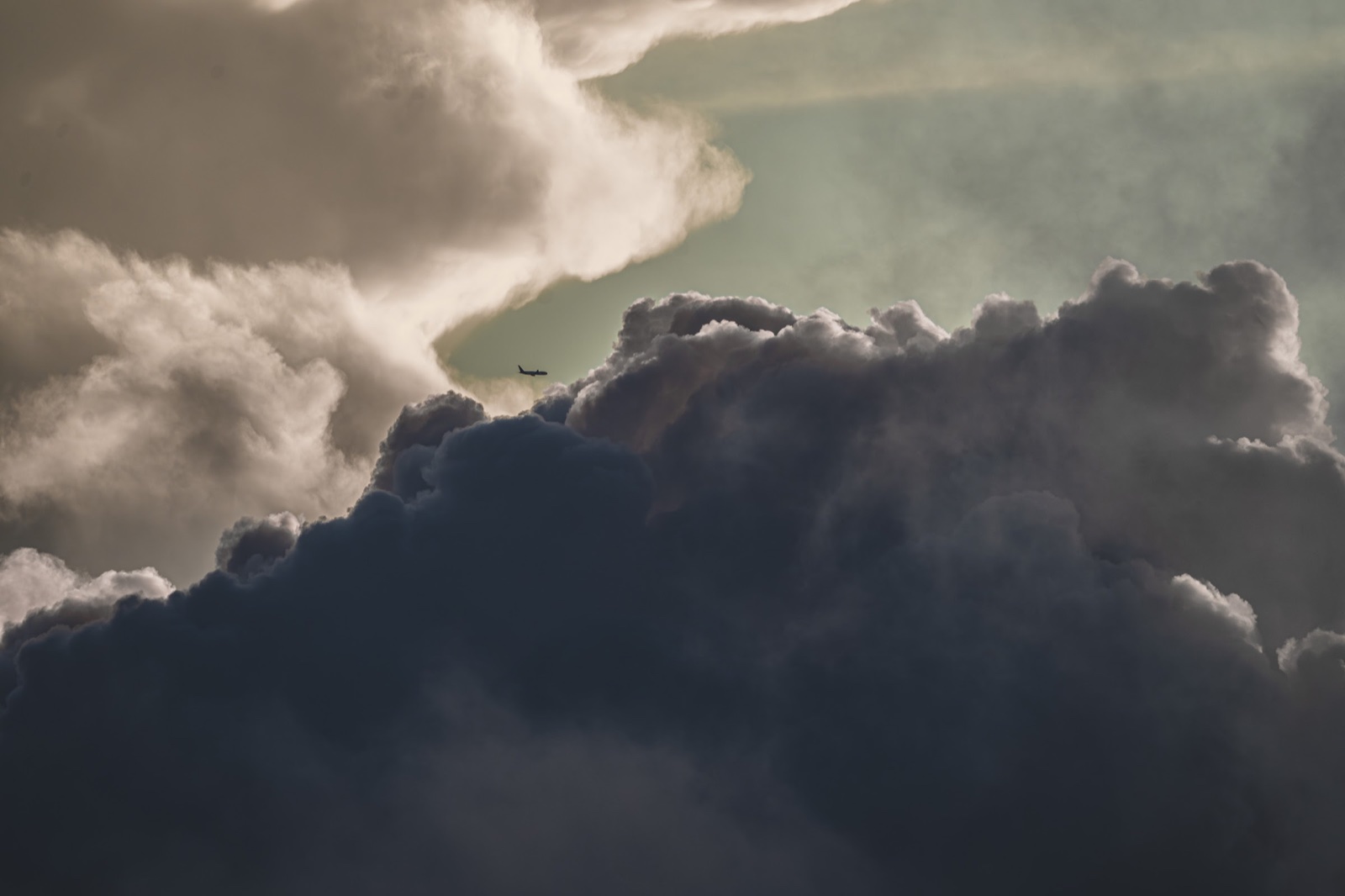 Airliner against the cloud wall